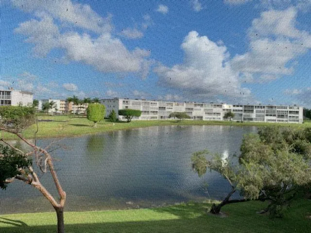 a view of a lake with a big yard