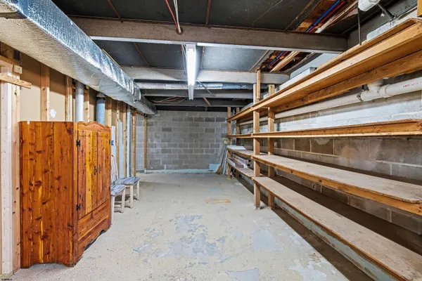 a view of an empty room with wooden walls