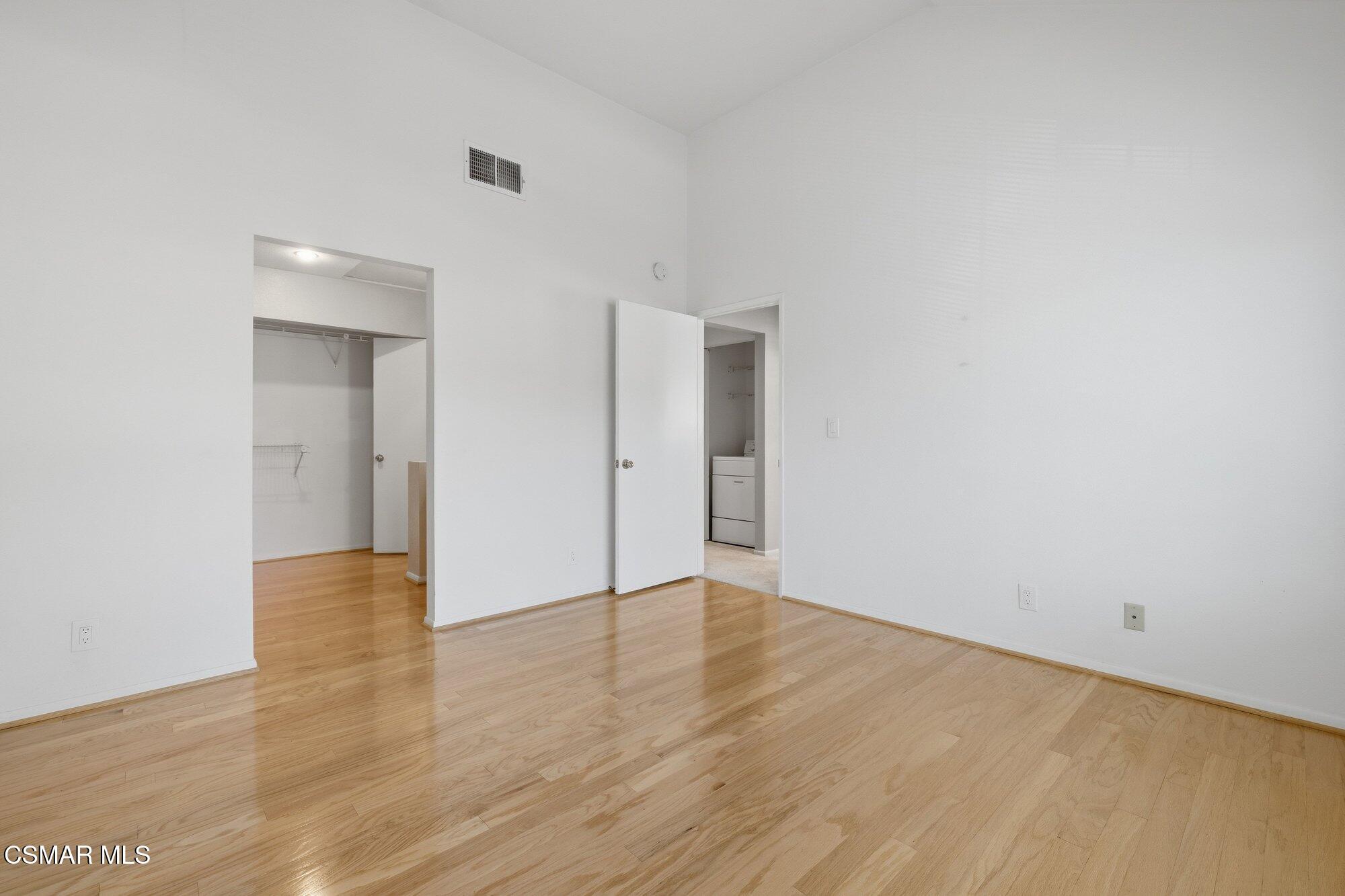 4240 Lost Hills Road, Unit 206 Agoura Hills, CA 91301 - Photo 4 of 28 a view of an empty room with wooden floor and closet