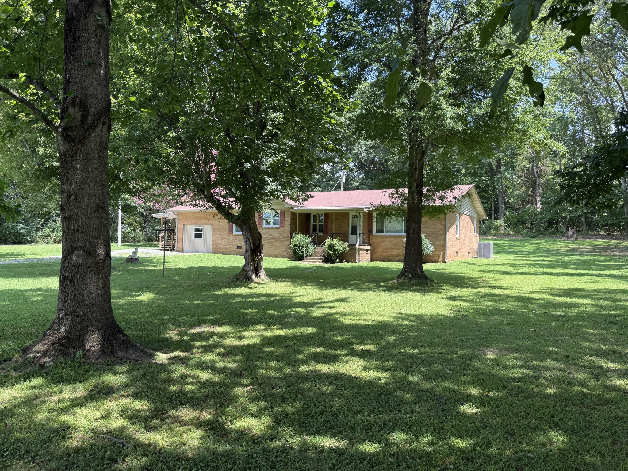 a view of a house with a yard porch and sitting area