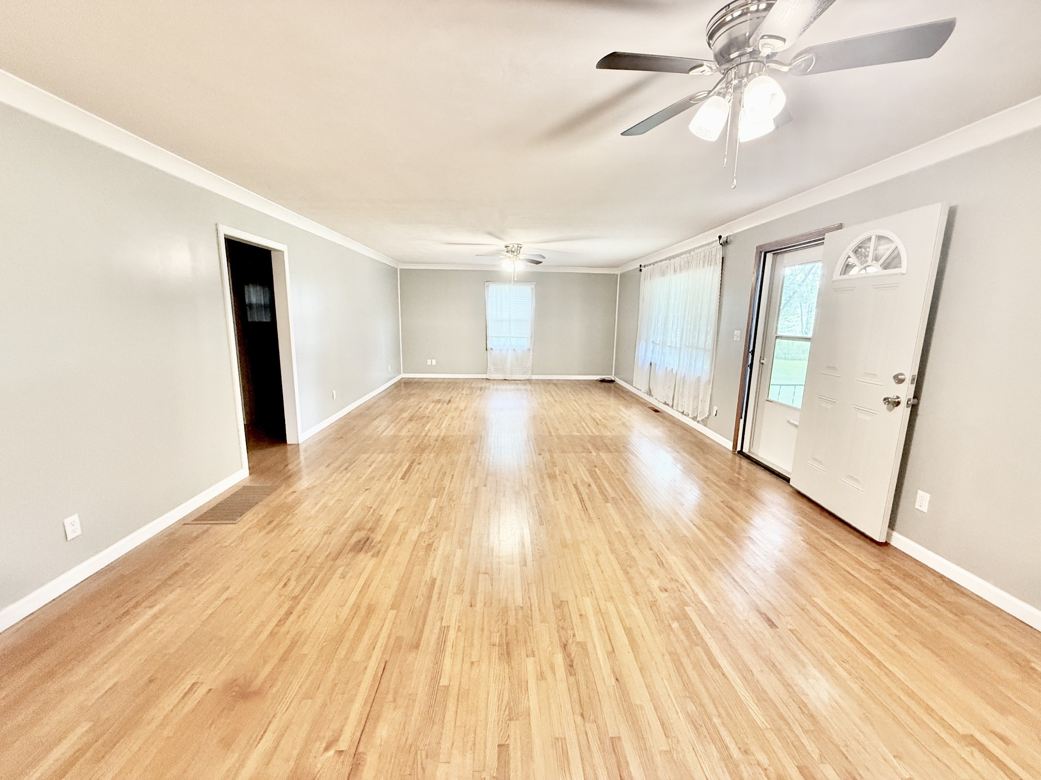 1520 Old Springville Road Springville, TN 38256 - Photo 2 of 16 wooden floor in an empty room with a window