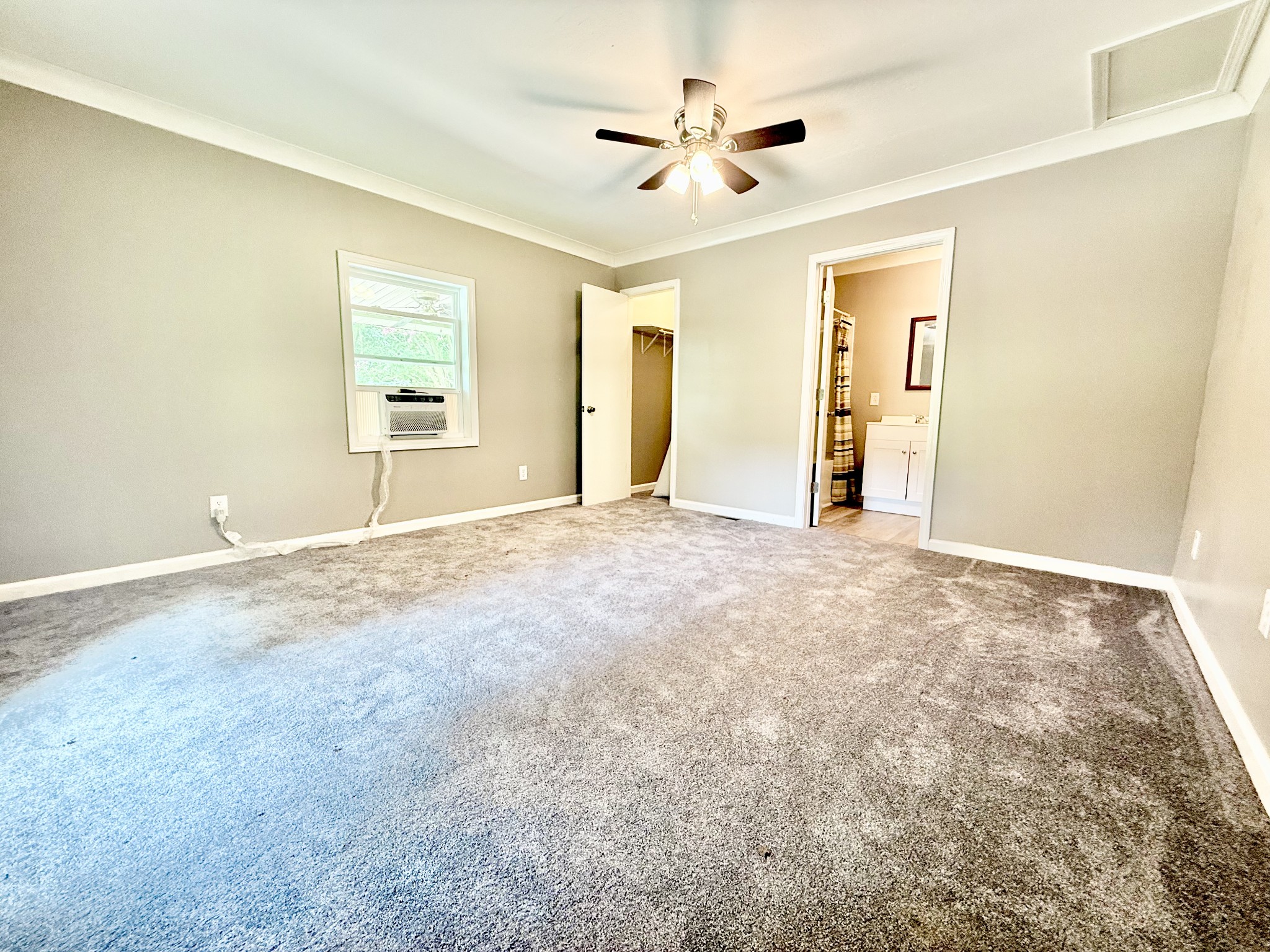 1520 Old Springville Road Springville, TN 38256 - Photo 5 of 16 a view of an empty room with chandelier fan and a window