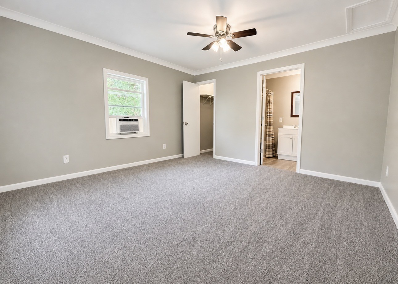 1520 Old Springville Road Springville, TN 38256 - Photo 6 of 22 a view of a big room with windows and chandelier fan