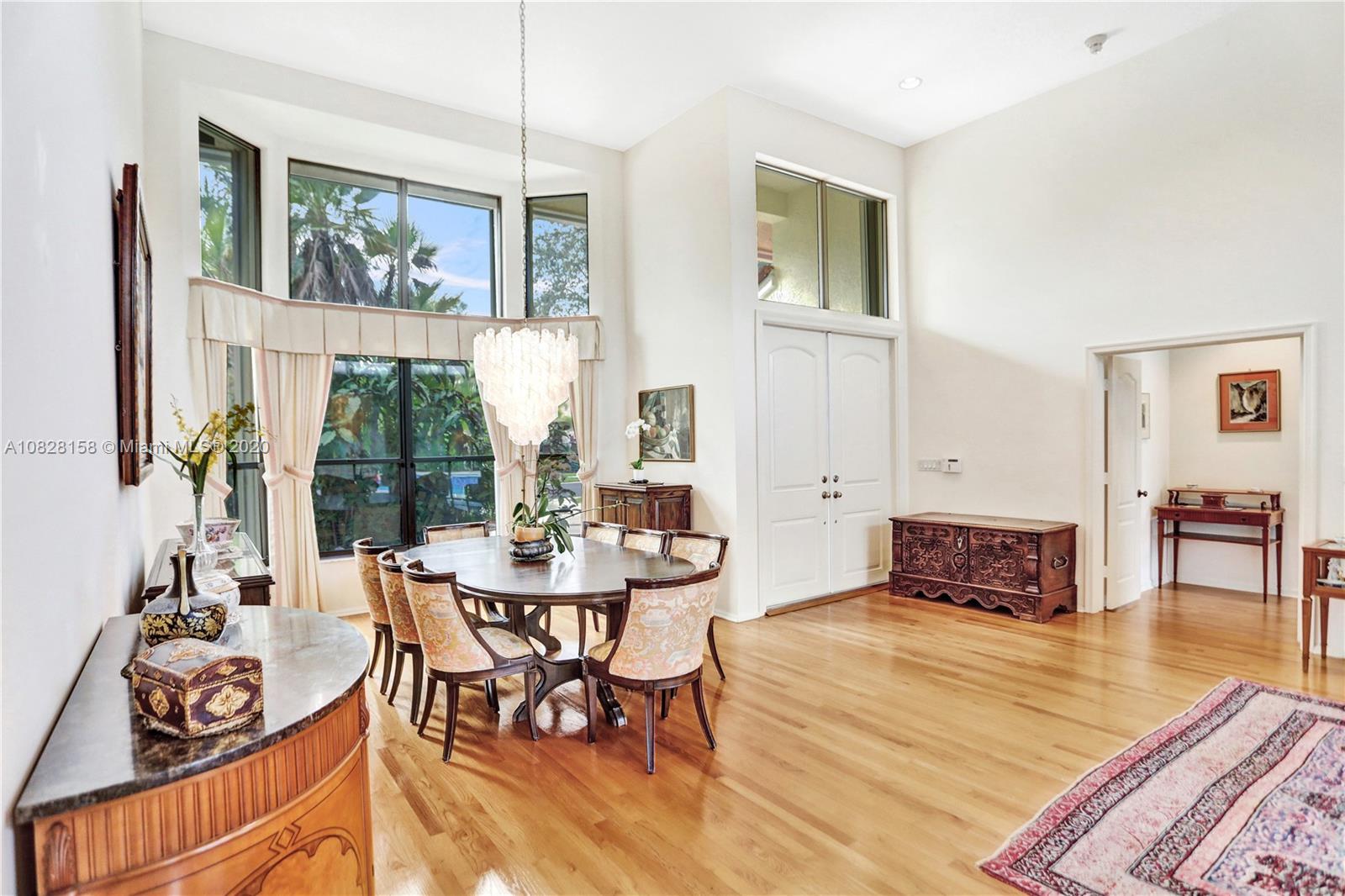 390 Alexandra Circle Weston, FL 33326 - Photo 11 of 71 a living room with furniture and a floor to ceiling window