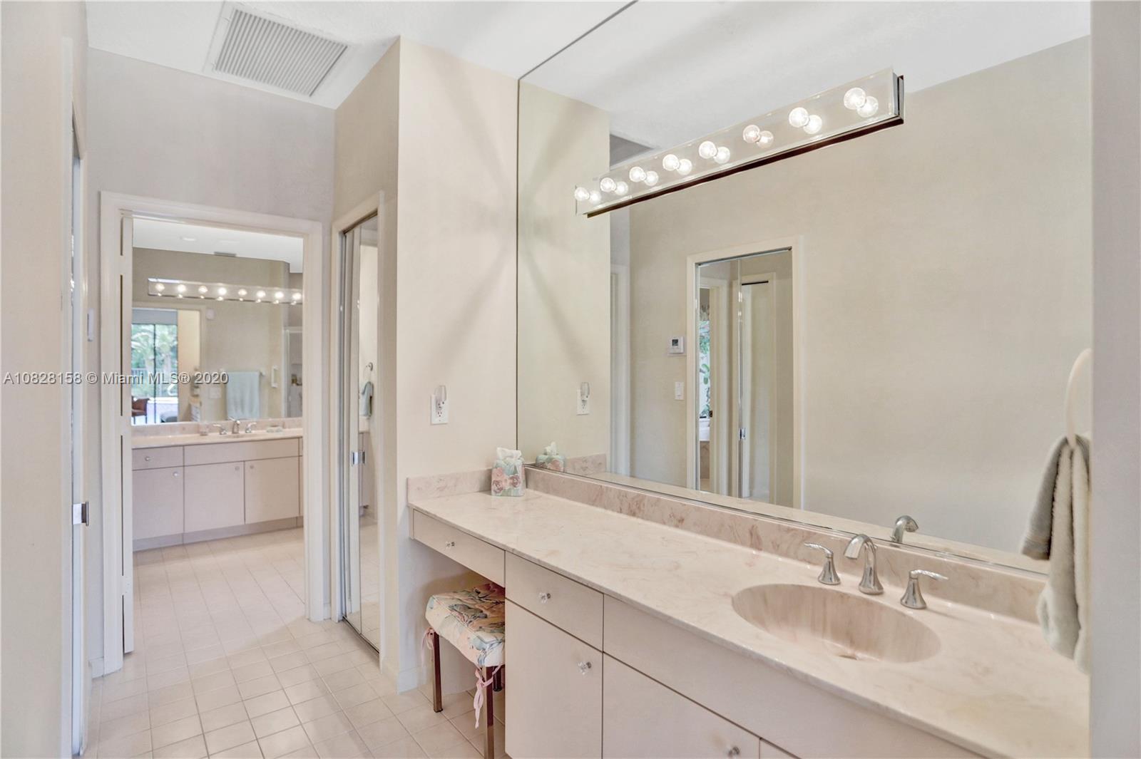 390 Alexandra Circle Weston, FL 33326 - Photo 14 of 71 a bathroom with a sink vanity granite tub and a mirror