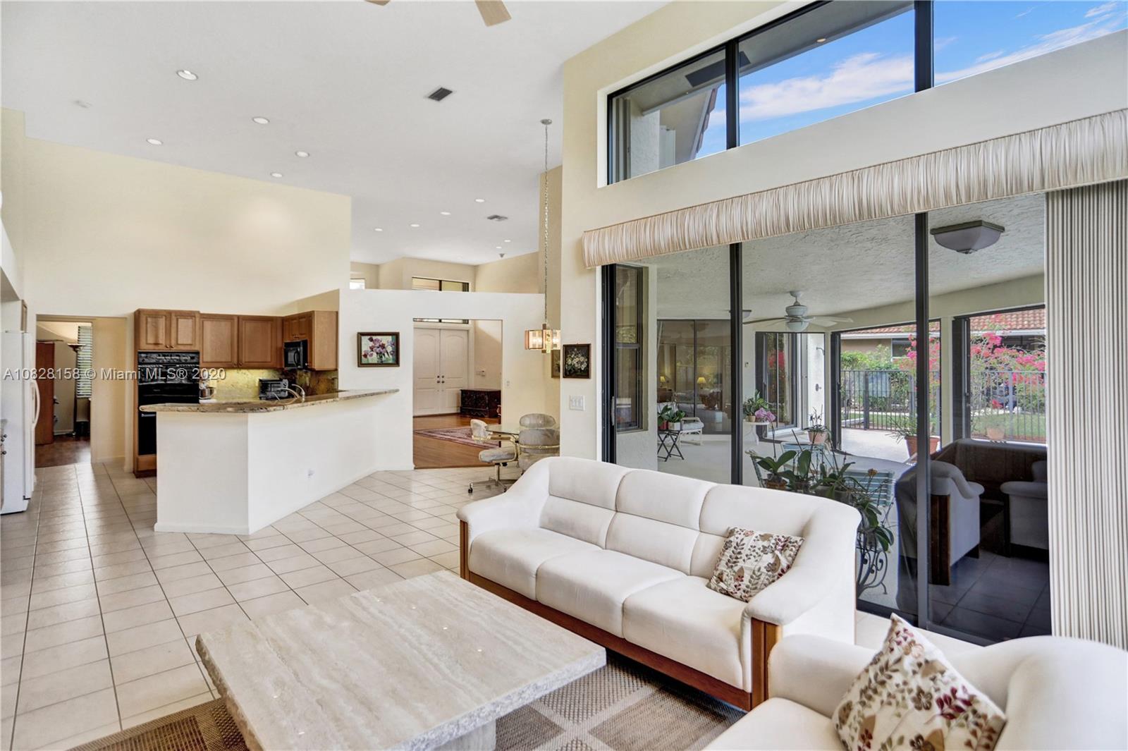 390 Alexandra Circle Weston, FL 33326 - Photo 24 of 71 a living room with furniture and view of kitchen
