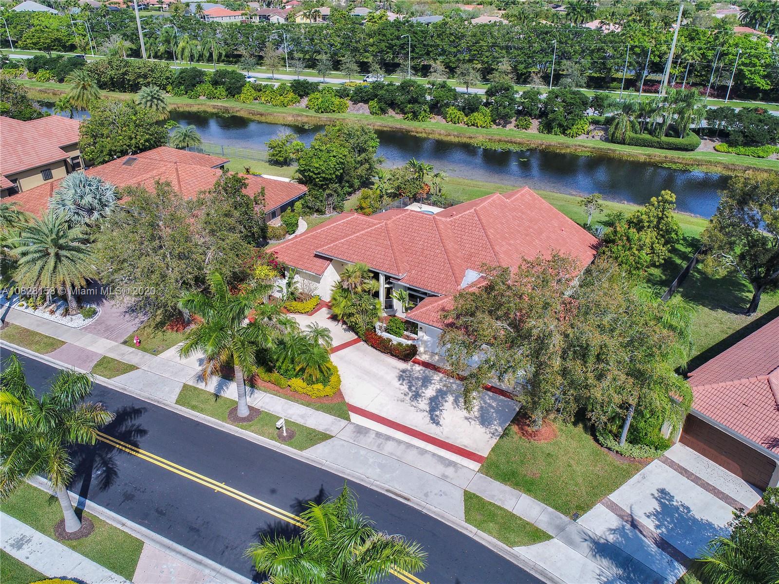 390 Alexandra Circle Weston, FL 33326 - Photo 3 of 71 an aerial view of a house with outdoor space lake view and boat