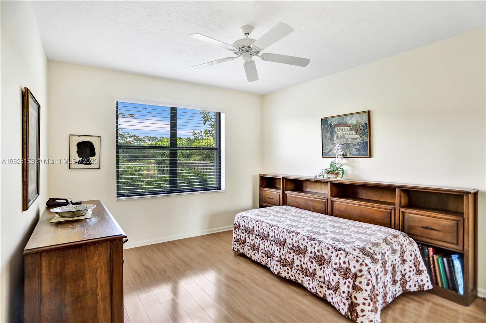 390 Alexandra Circle Weston, FL 33326 - Photo 33 of 71 a bedroom with a bed and a window