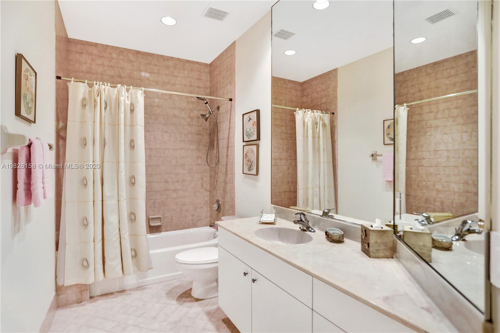 390 Alexandra Circle Weston, FL 33326 - Photo 35 of 71 a bathroom with a double vanity sink toilet mirror and shower