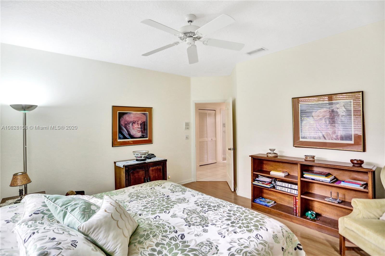 390 Alexandra Circle Weston, FL 33326 - Photo 40 of 71 a bedroom with a bed and dresser