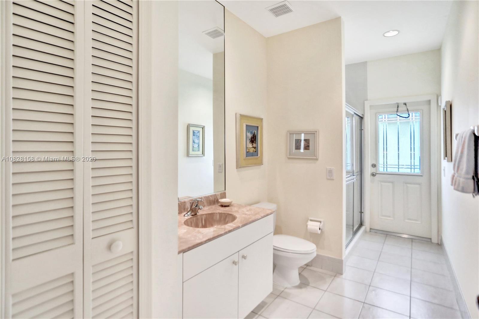 390 Alexandra Circle Weston, FL 33326 - Photo 41 of 71 a bathroom with a granite countertop sink toilet and shower