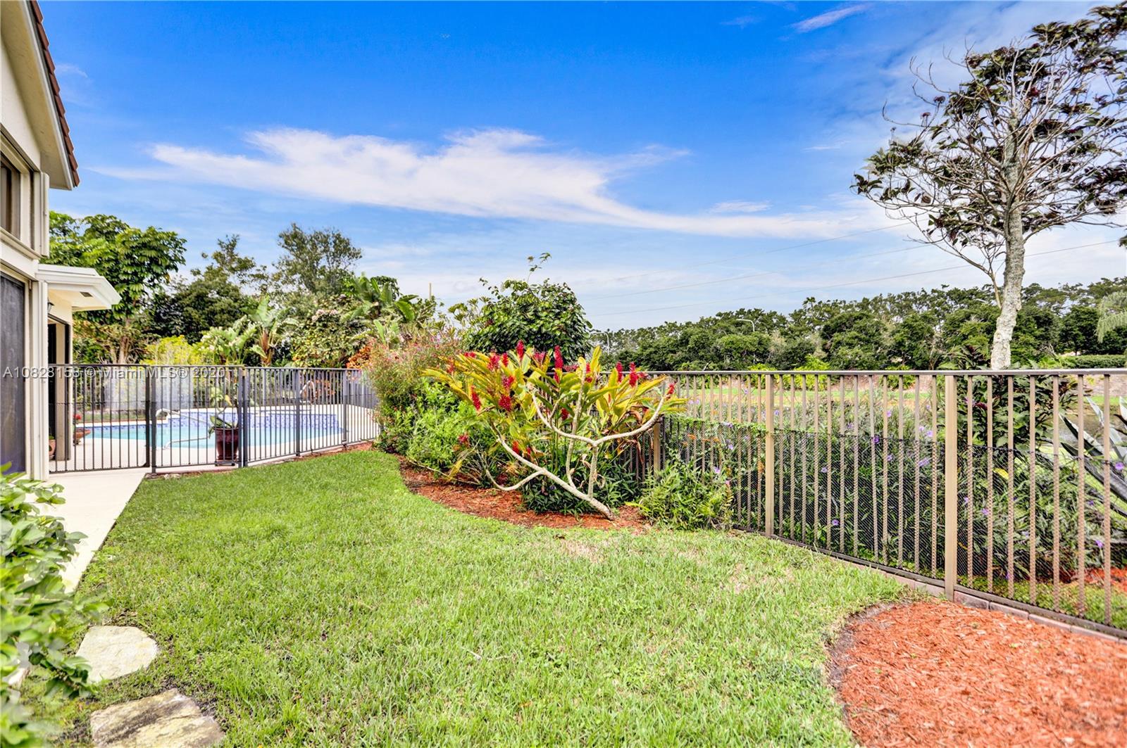 390 Alexandra Circle Weston, FL 33326 - Photo 47 of 71 a view of a garden with houses