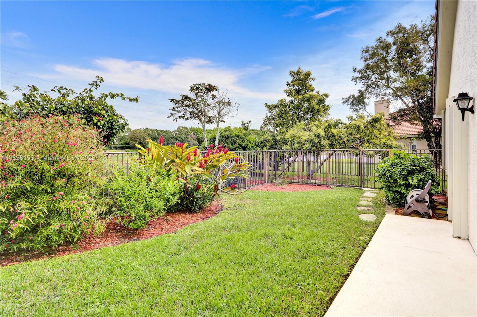 390 Alexandra Circle Weston, FL 33326 - Photo 48 of 71 a view of a garden with a flower garden