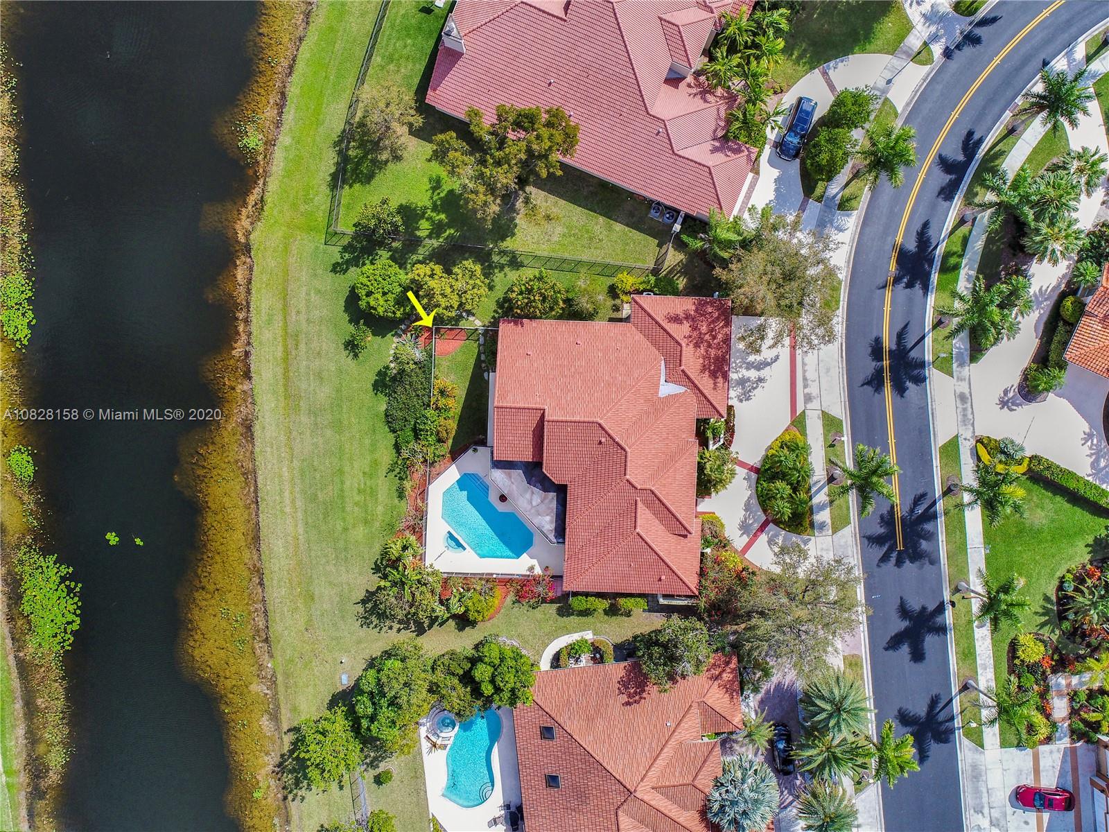 390 Alexandra Circle Weston, FL 33326 - Photo 57 of 71 an aerial view of a house with a yard and garden