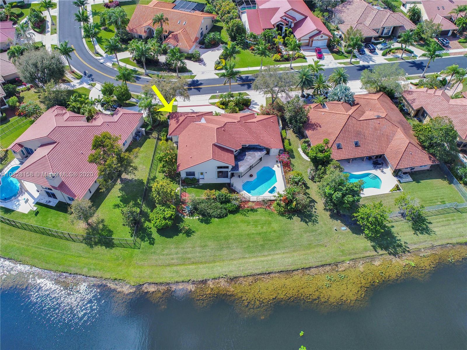 390 Alexandra Circle Weston, FL 33326 - Photo 59 of 71 an aerial view of lake and residential houses with outdoor space and lake view