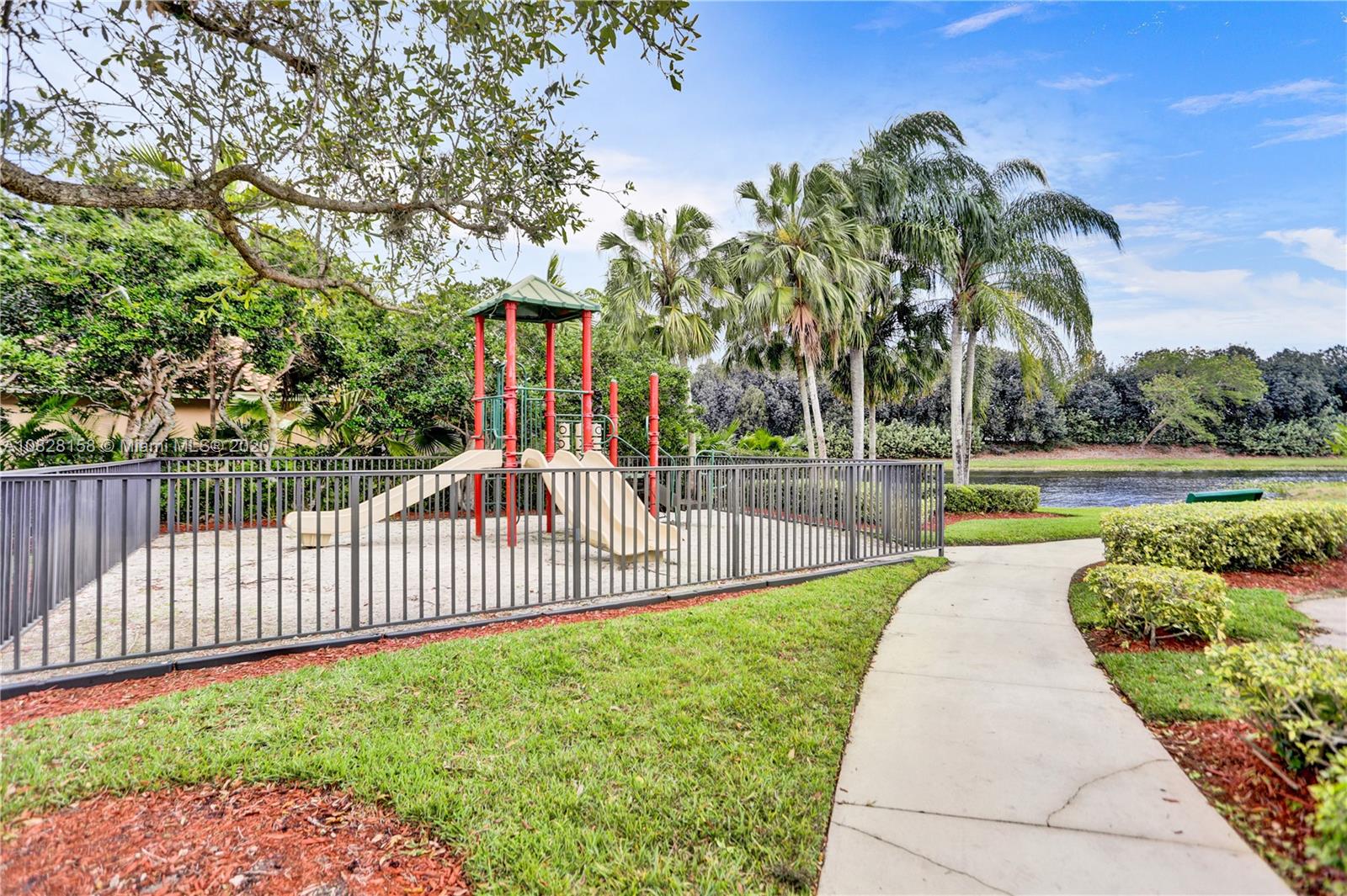 390 Alexandra Circle Weston, FL 33326 - Photo 68 of 71 a view of a swimming pool with a patio