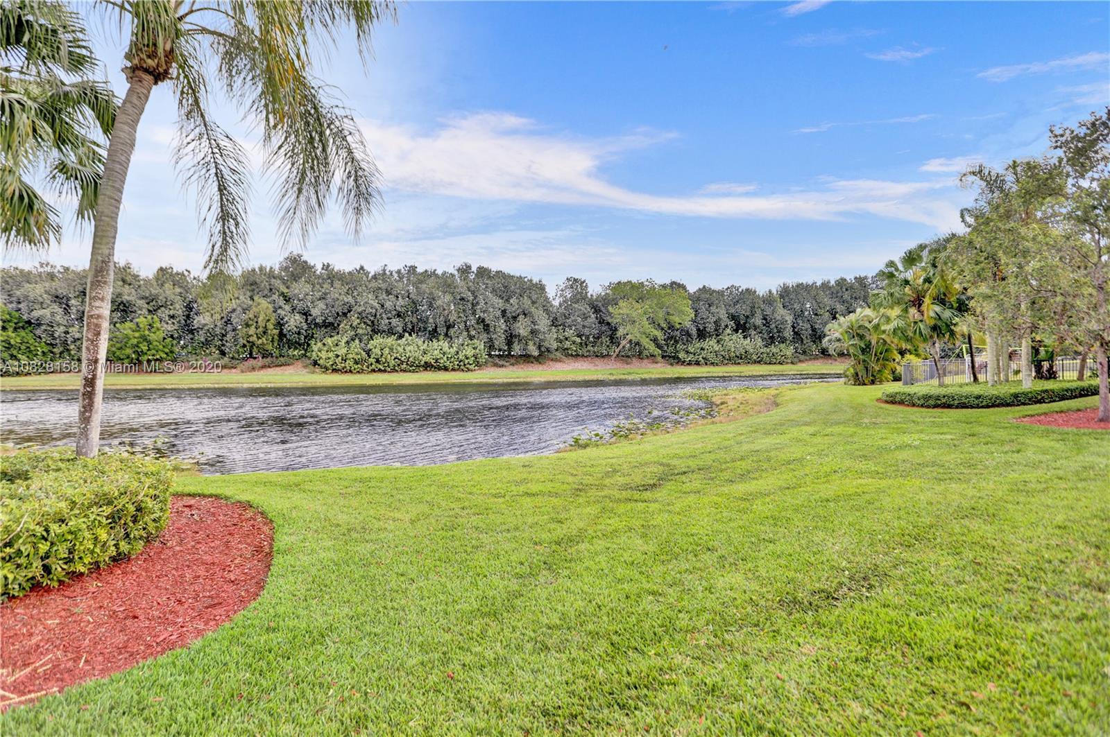 390 Alexandra Circle Weston, FL 33326 - Photo 69 of 71 a view of a yard with a large trees