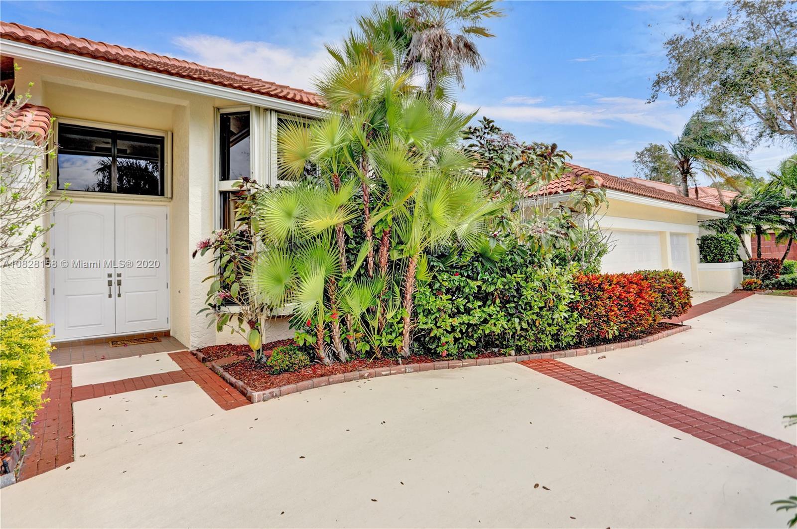 390 Alexandra Circle Weston, FL 33326 - Photo 7 of 71 front view of a house with a yard and potted plants