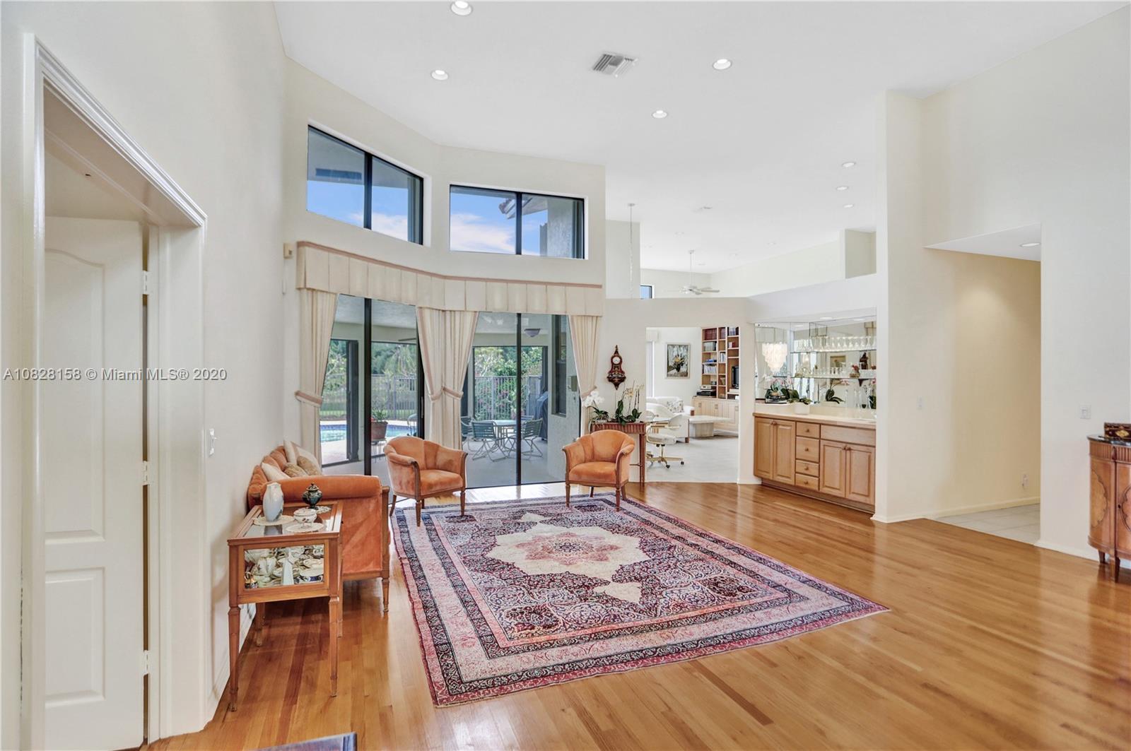 390 Alexandra Circle Weston, FL 33326 - Photo 8 of 71 a living room with furniture and a wooden floor