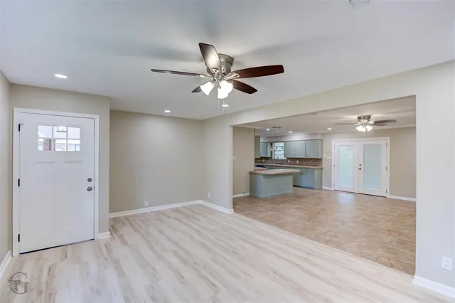 a view of a kitchen with a sink and a stove top oven