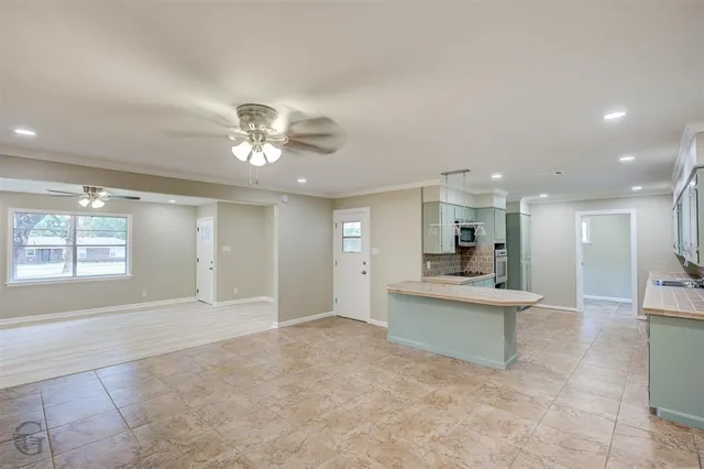 a view of a livingroom with a kitchen