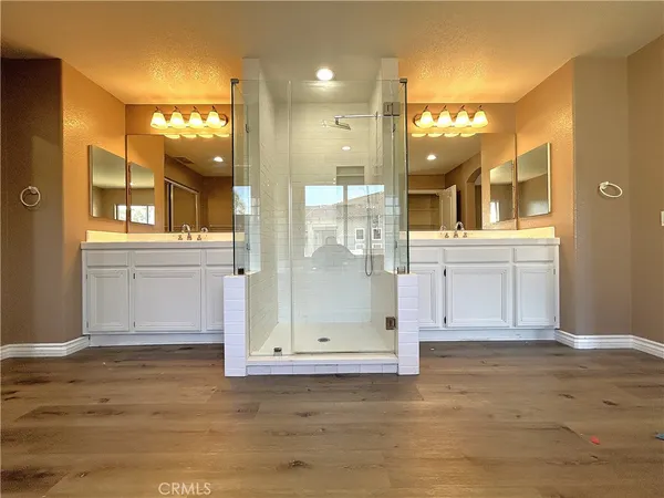a view of a bathroom with a glass door shower