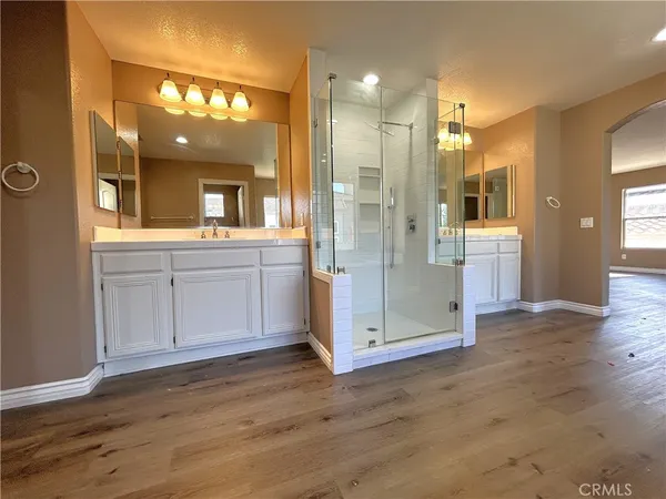 a view of a bathroom with a glass door shower