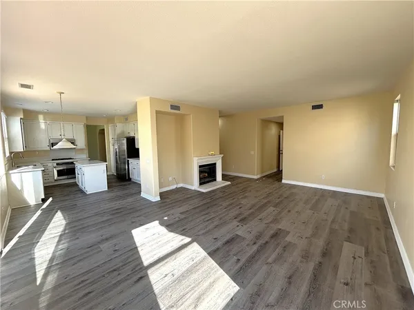 a view of livingroom with hardwood floor and a fireplace