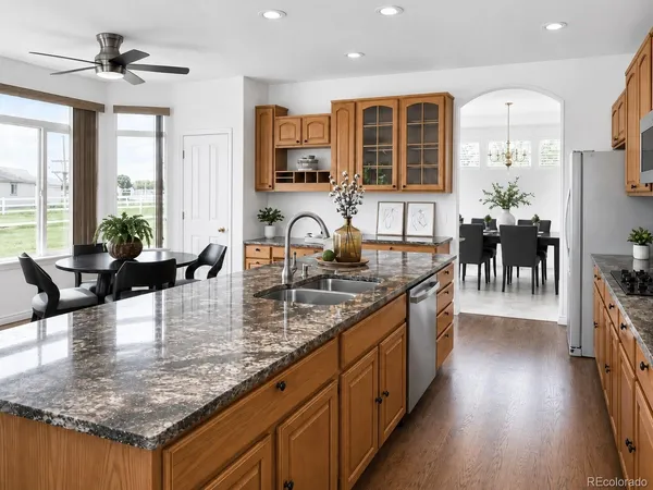 a kitchen with counter top space a sink and appliances