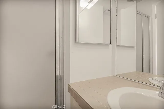 a bedroom with a bed and a hallway