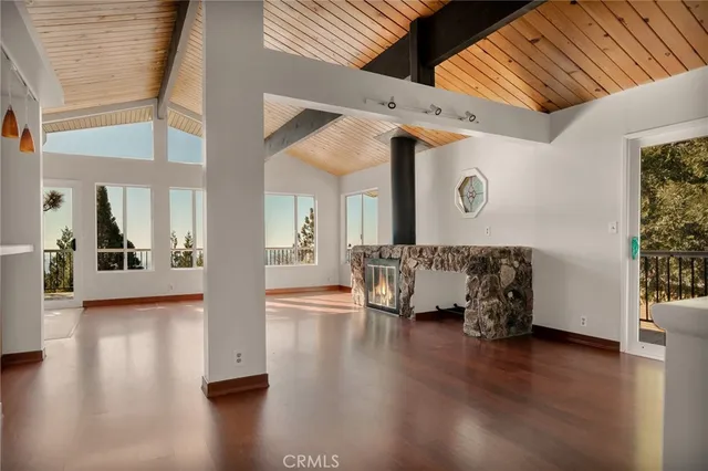 a view of an entryway with wooden floor