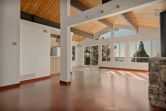 a view of an entryway with wooden floor