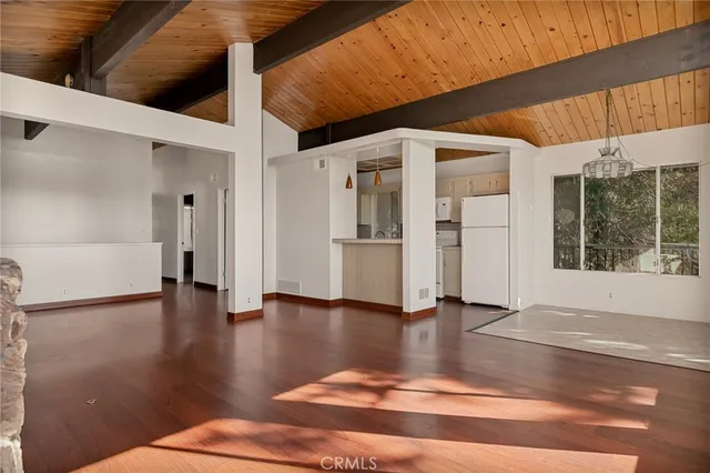 a view of an entryway with wooden floor