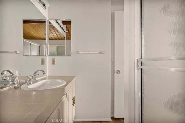 a bathroom with a sink and a mirror