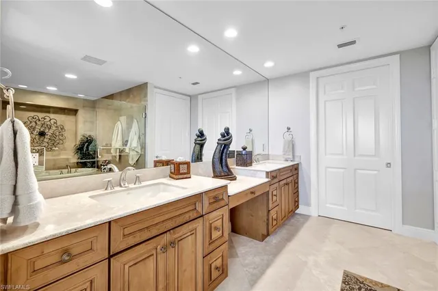 a large kitchen with kitchen island a sink stainless steel appliances and cabinets