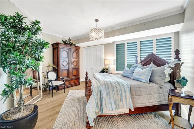 a bedroom with a bed and a couch