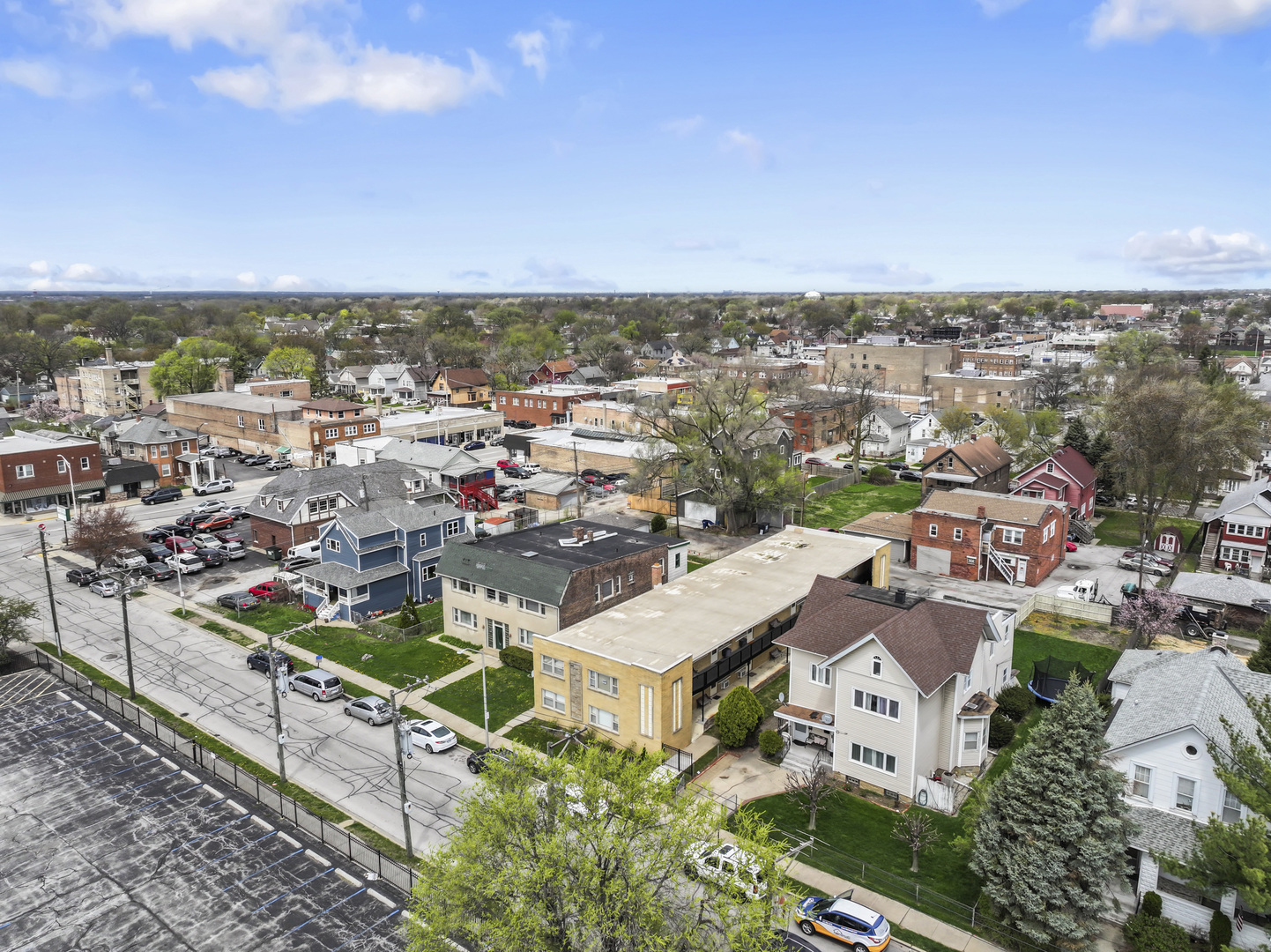 2336 Union Street, Unit 3 Blue Island, IL 60406 - Photo 19 of 19 an aerial view of a city with lots of residential buildings and ocean view in back