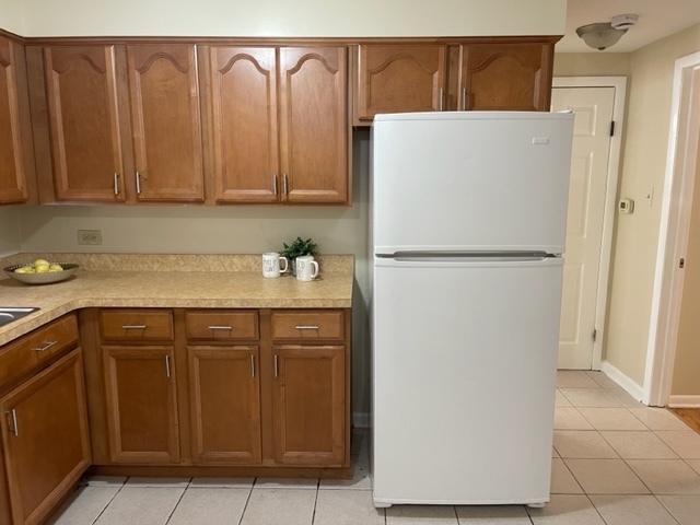 2336 Union Street, Unit 3 Blue Island, IL 60406 - Photo 8 of 19 a white refrigerator freezer sitting in a kitchen
