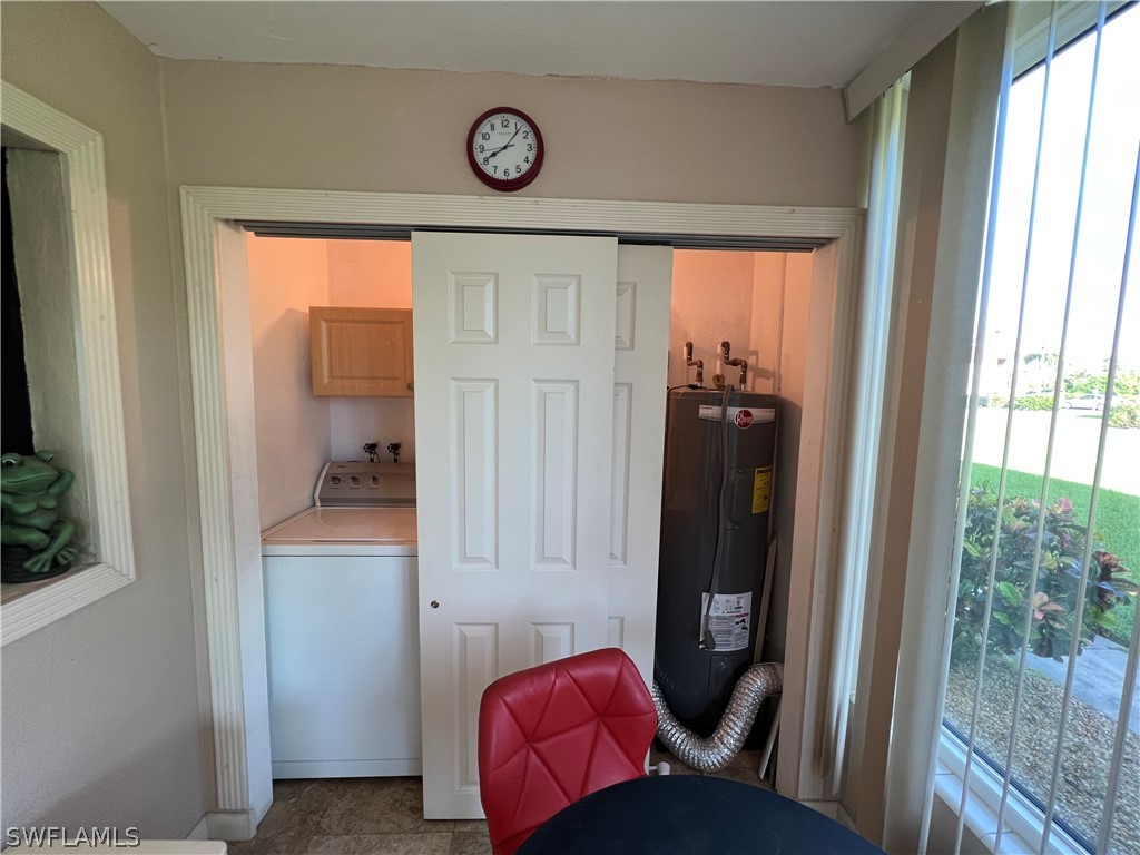 1372 Archer Street, Unit 4 Lehigh Acres, FL 33936 - Photo 15 of 22 a view of a hallway and a livingroom with furniture