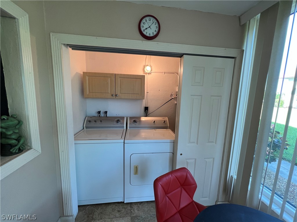 1372 Archer Street, Unit 4 Lehigh Acres, FL 33936 - Photo 18 of 22 a view of a room with washer and dryer