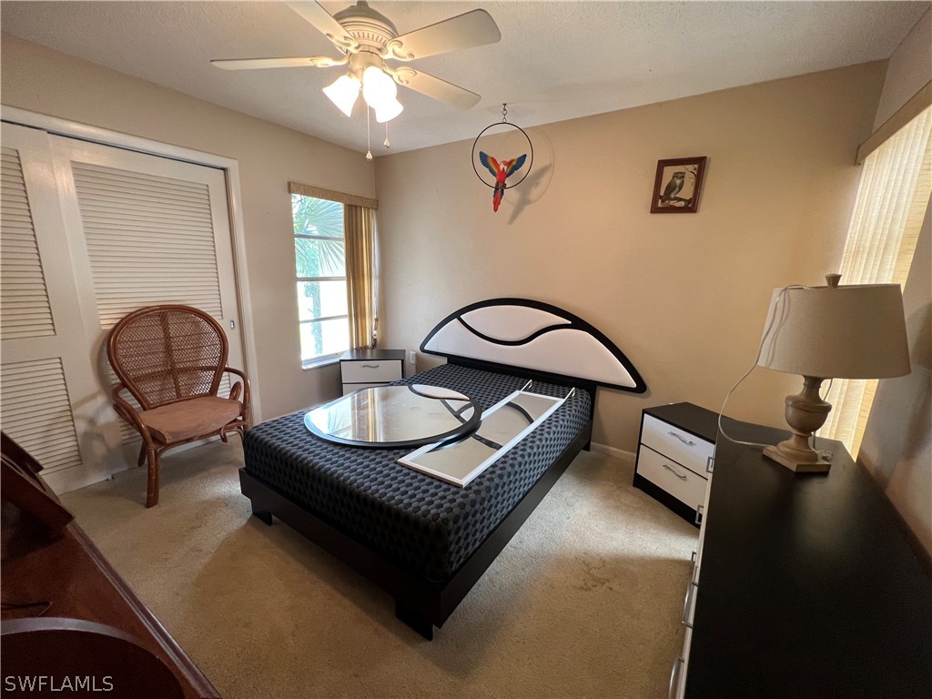 1372 Archer Street, Unit 4 Lehigh Acres, FL 33936 - Photo 21 of 22 a living room with furniture and window