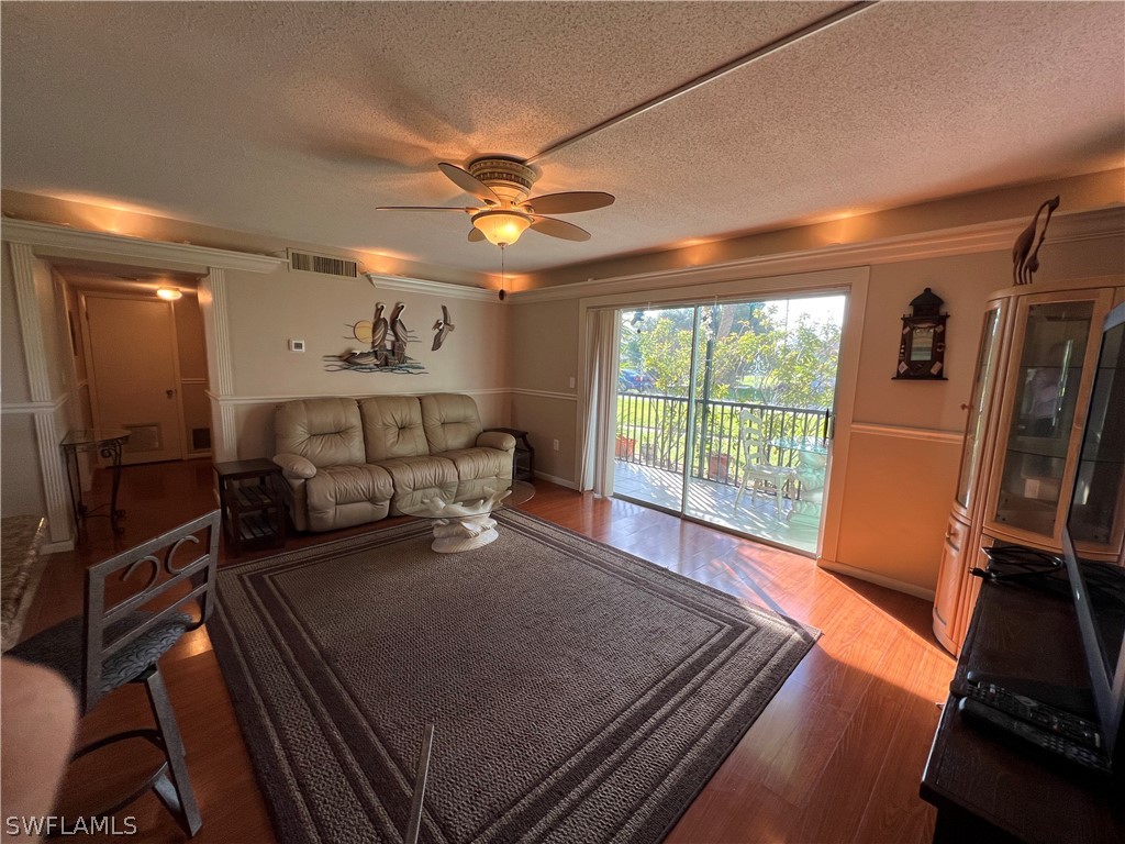 1372 Archer Street, Unit 4 Lehigh Acres, FL 33936 - Photo 9 of 22 a bed room with a bed furniture and a large window