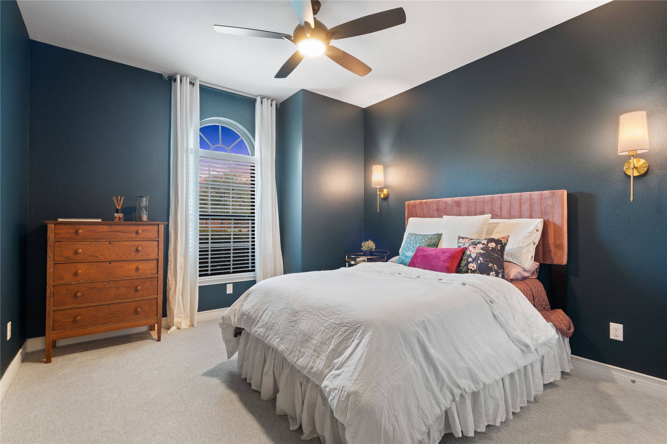 2829 Long Lasso Pass Leander, TX 78641 - Photo 6 of 40 a bedroom with a bed and a chandelier