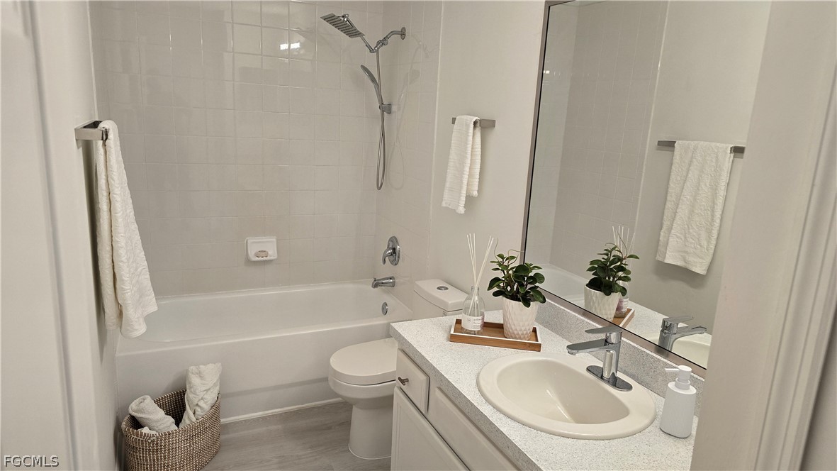 236-238 Peerless Street Lehigh Acres, FL 33974 - Photo 13 of 25 a bathroom with a sink toilet and shower