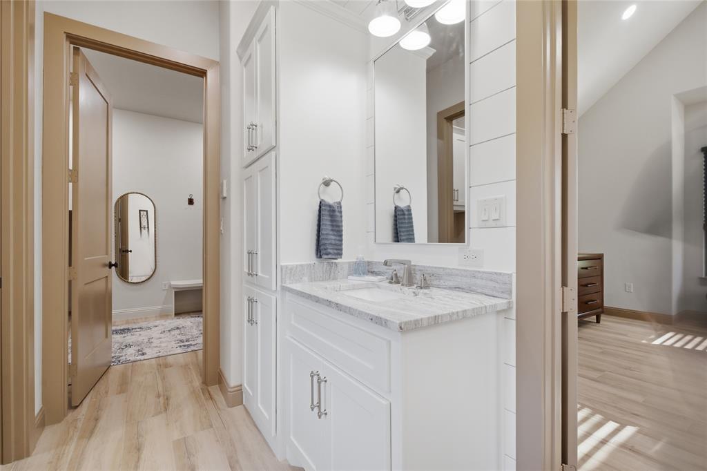 958 Cedar Mills Road Gordonville, TX 76245 - Photo 20 of 40 a spacious bathroom with a sink a mirror and a shower