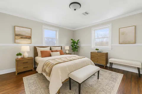 a bed room with a bed and a chair