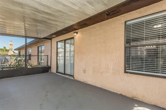 a view of a house with backyard and garden