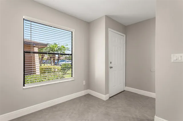 a view of an empty room with a window