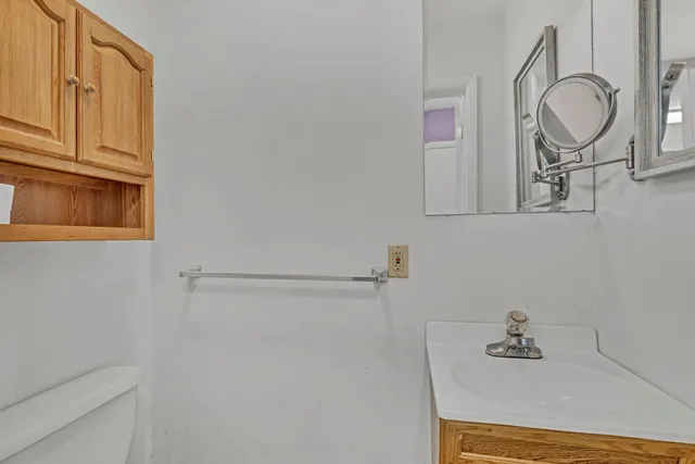 a bathroom with a sink a vanity and mirror