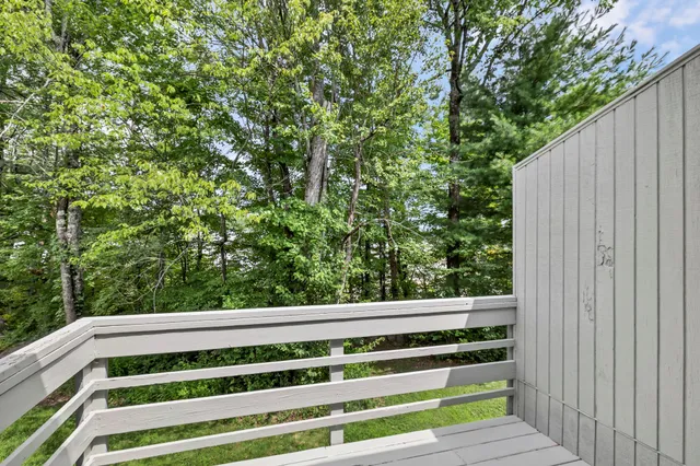 a view of wooden fence and trees